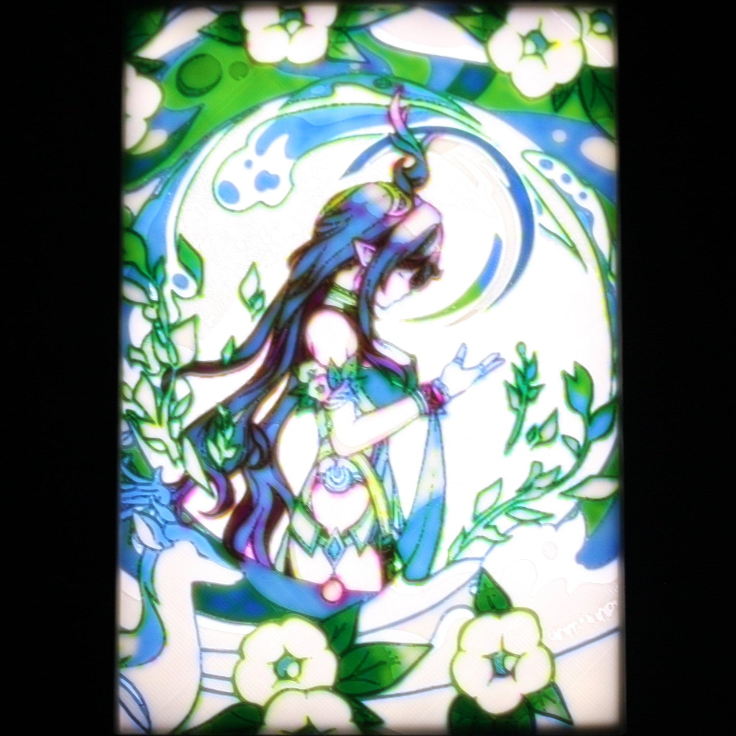 Lauma win a green plant filled background.